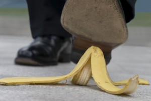 Businessman about to step on a banana skin